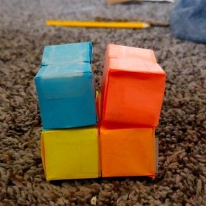 Multi colored fidget cube and a pop it